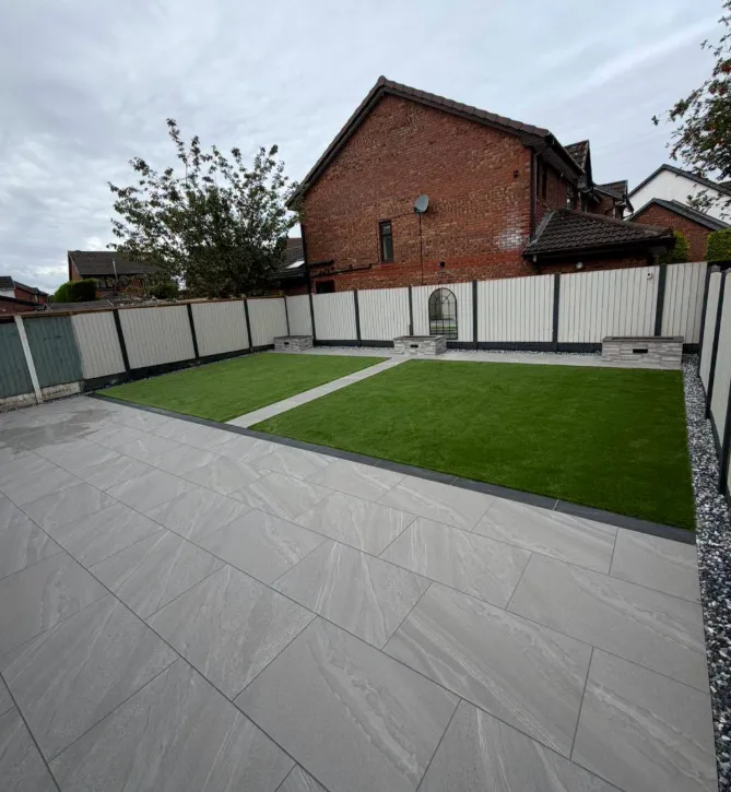Wide patio and lawn garden with pale fencing