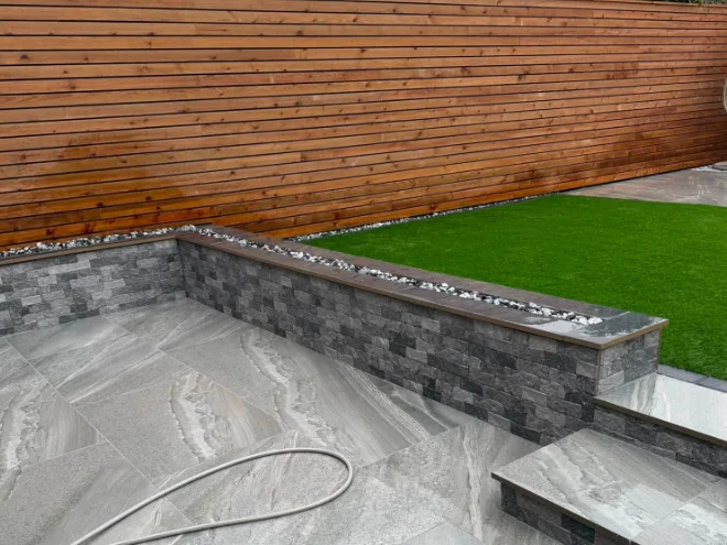 Garden landscaping with retaining wall and steps by KLG Landscape
